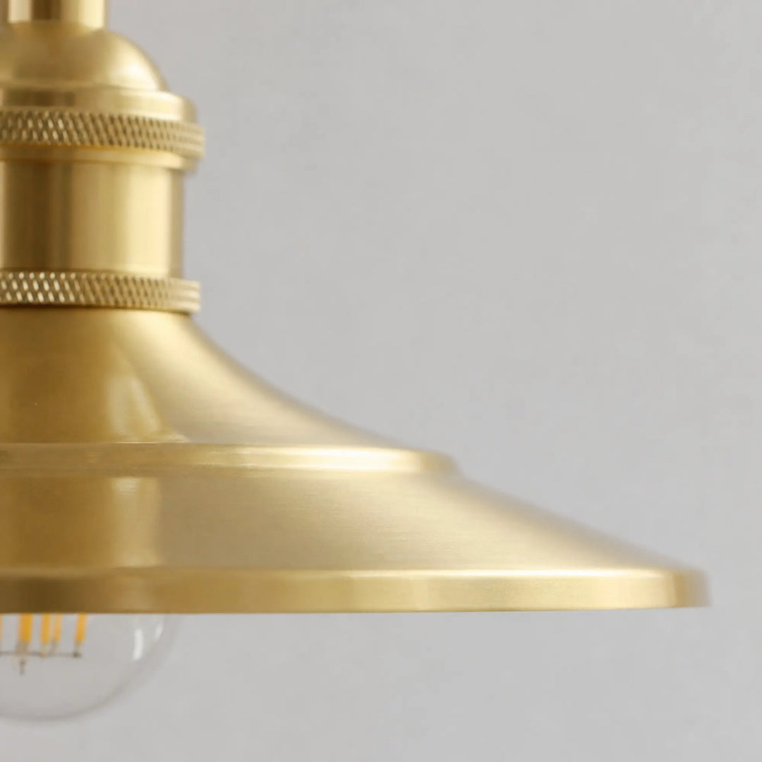 Close-up of the smooth polished brass shade edge