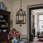 Load image into Gallery viewer, Rustic birdcage pendant lamp installed above a dining room table