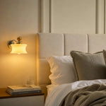 Charger l'image dans la visionneuse de galerie, Cream glass wall lamp casting warm bedside light