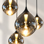 Charger l'image dans la visionneuse de galerie, Close-up of smoked mouth-blown glass shades, lit