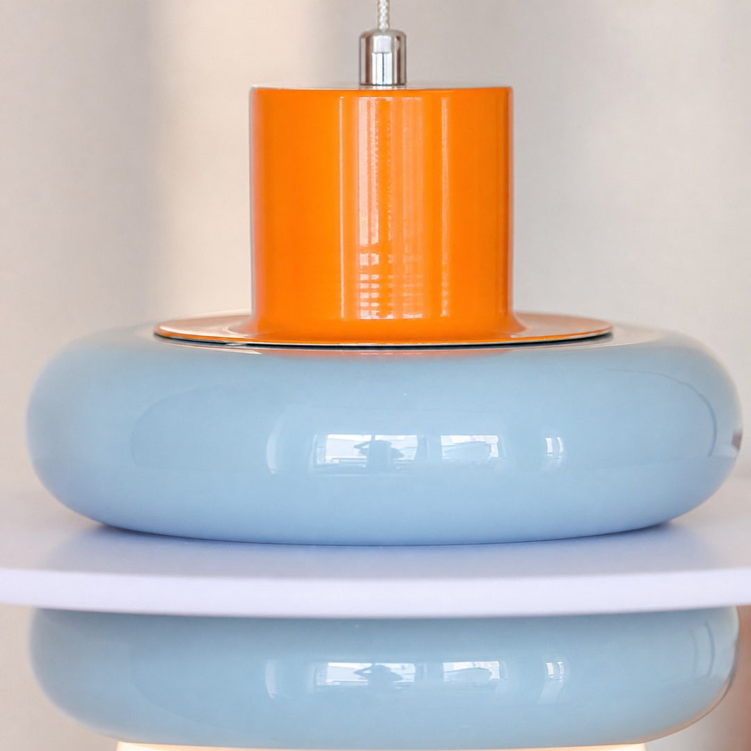 Close-up of sea salt blue layered shade and orange accent
