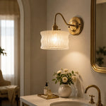 Cargar imagen en el visor de la Galería, Frosted ripple glass wall sconce above a vanity counter