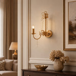 Load image into Gallery viewer, Crystal candle wall sconce above a dark wood console in a refined living space