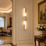 Charger l'image dans la visionneuse de galerie, Travertine acrylic wall lamps lighting a warm classic entry wall