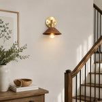 Load image into Gallery viewer, Compact wood and brass wall sconce beside a staircase
