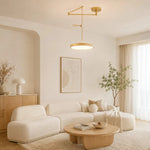 Load image into Gallery viewer, Gold movable pendant light in a neutral living room