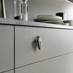 Cargar imagen en el visor de la Galería, Chrome silver carrot knob on a gray drawer