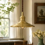 Bild in Gallery-Viewer laden, Polished brass pendant light in a warm kitchen setting