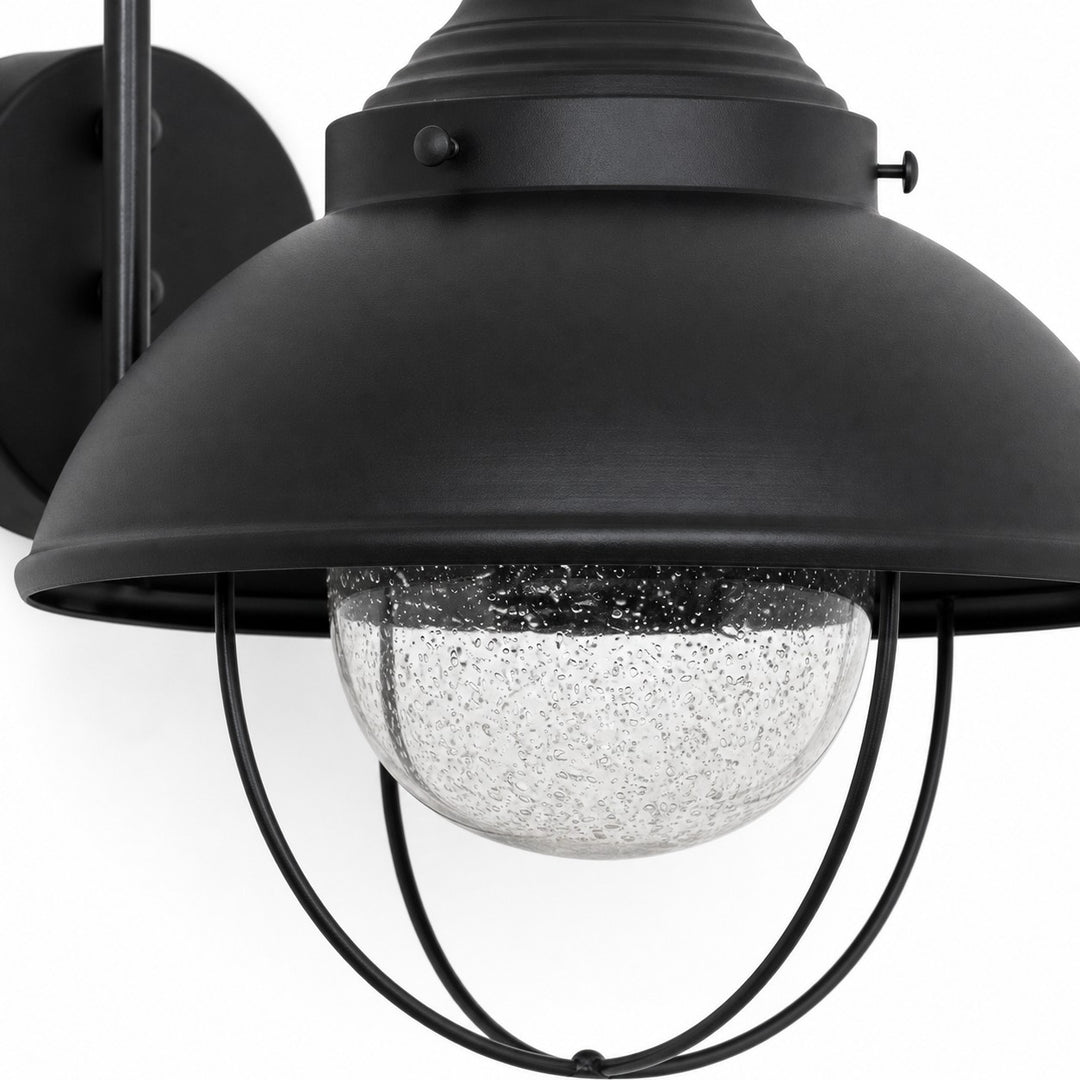 Seeded-glass globe beneath a black metal shade and cage