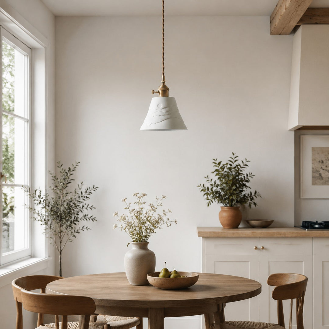 Ceramic pendant light installed near a bright dining corner