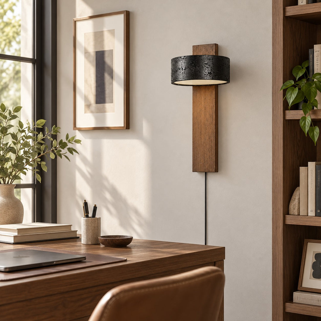 Walnut and black travertine wall sconce in a living room