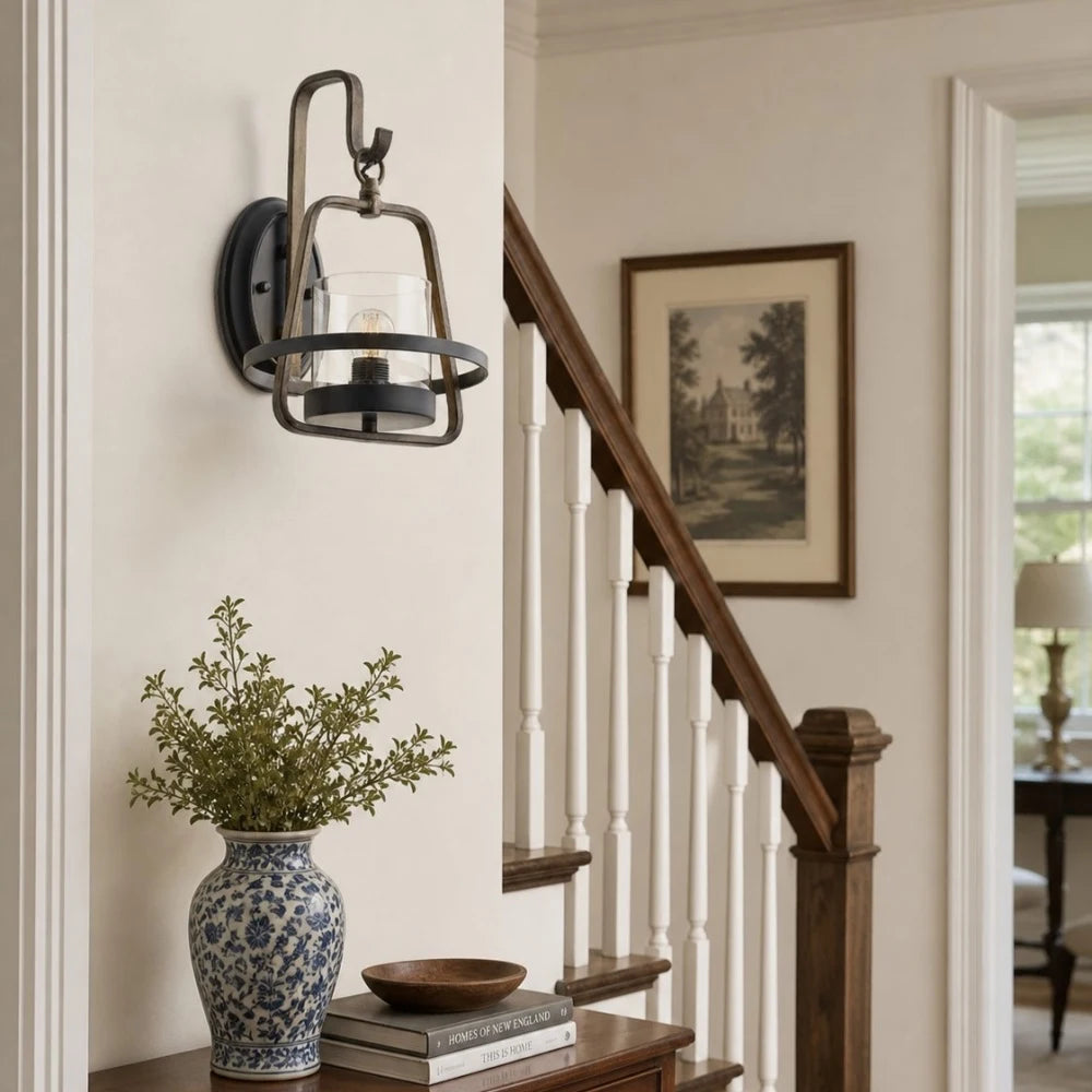 Rust metal wall sconce styled near entry table