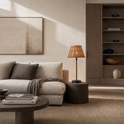 Rattan table lamp in a neutral living room