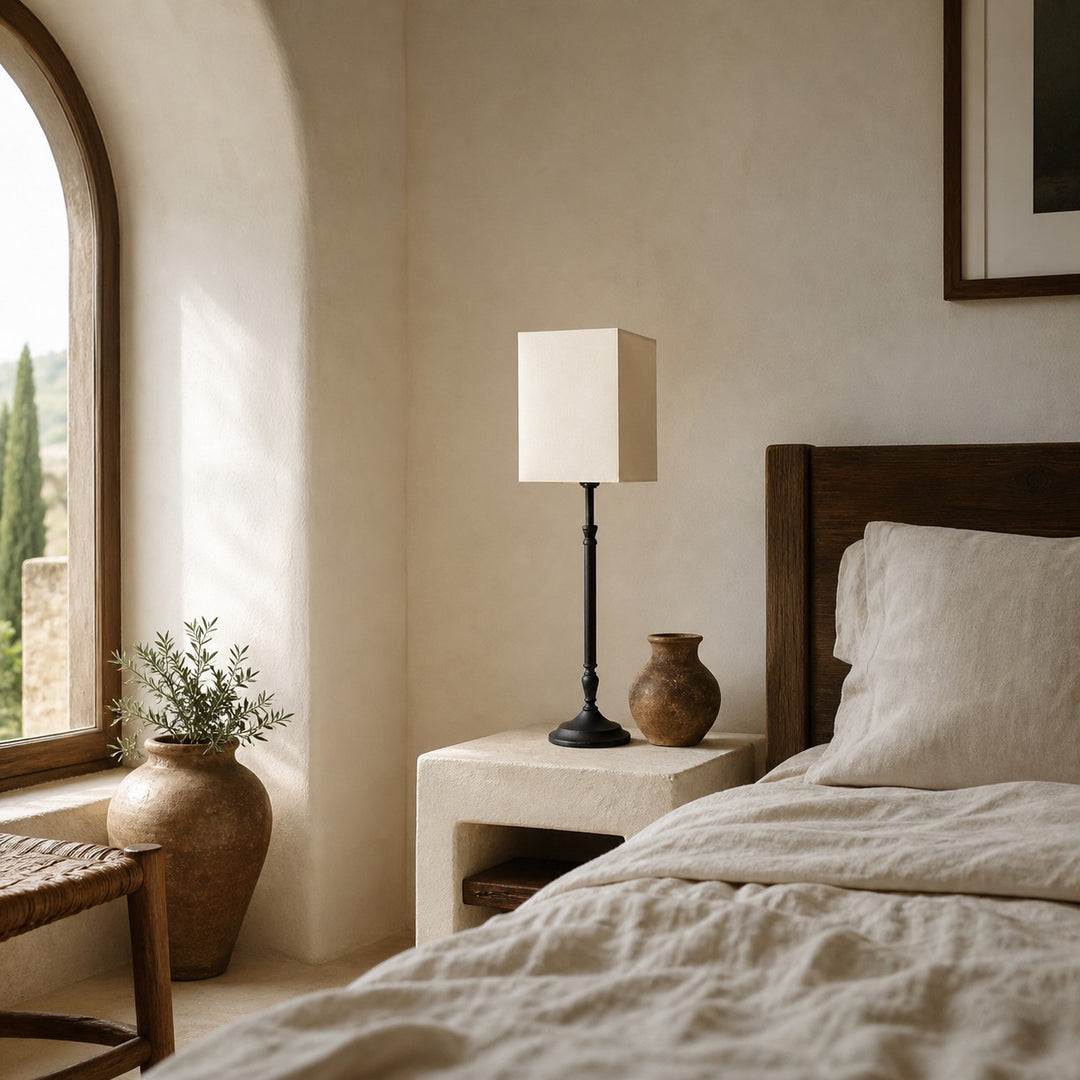 Square fabric shade table lamp in a bedroom