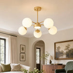Load image into Gallery viewer, Five-light milk glass chandelier in a living room