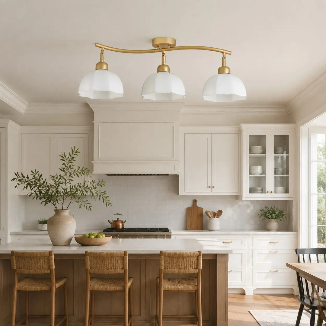 Gold 3-light ceiling fixture above a kitchen island