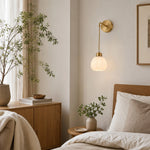 Load image into Gallery viewer, Petal shade wall sconce installed beside a bedroom
