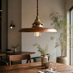 Load image into Gallery viewer, Distressed gold pendant light in a dining room