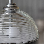 Load image into Gallery viewer, Close detail of the clear glass shade profile and metal hardware