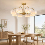 Load image into Gallery viewer, 8-light gold chandelier installed above a dining table