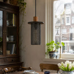 Cargar imagen en el visor de la Galería, Black woven mesh pendant light beside a vintage cabinet