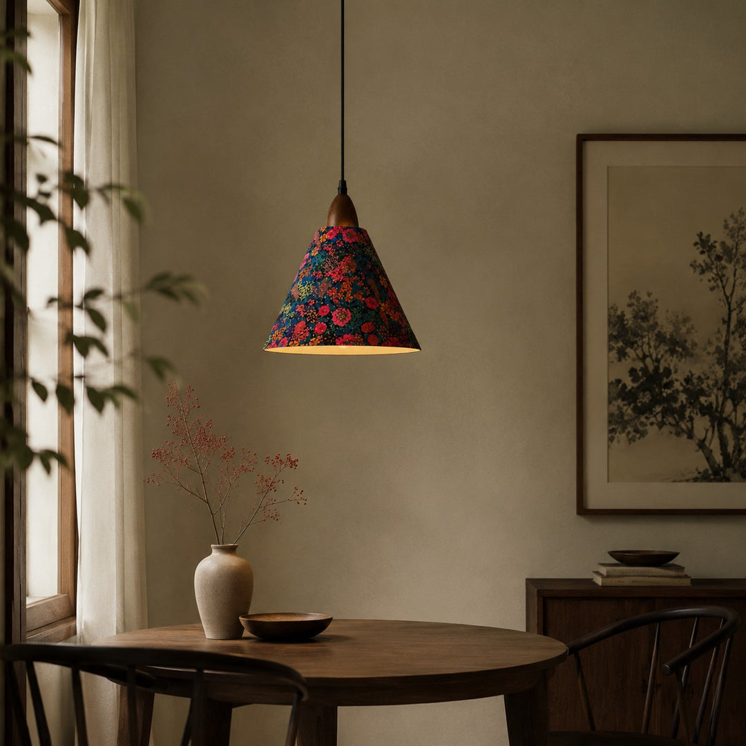 Gold foil floral pendant in softly lit dining room
