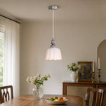 Bild in Gallery-Viewer laden, White ceramic pendant lamp above a dining table