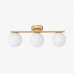 Load image into Gallery viewer, Gold three-light ceiling light with milk glass shades