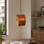 Bild in Gallery-Viewer laden, Hand-laced leather cylinder pendant light in an interior setting