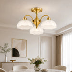 Bild in Gallery-Viewer laden, Gold three-light chandelier in a refined dining room