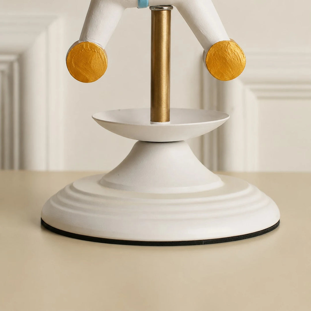 White lamp base and brass stem detail