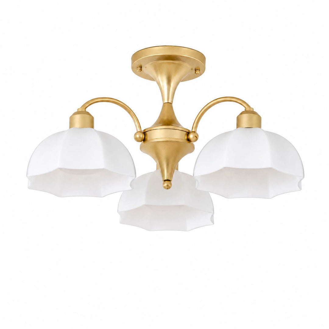 Gold three-light chandelier with white glass shades
