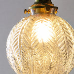 Load image into Gallery viewer, ribbed clear glass pendant shade with warm bulb glow