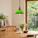 Cargar imagen en el visor de la Galería, Green glass pendant lamp above a wooden dining table
