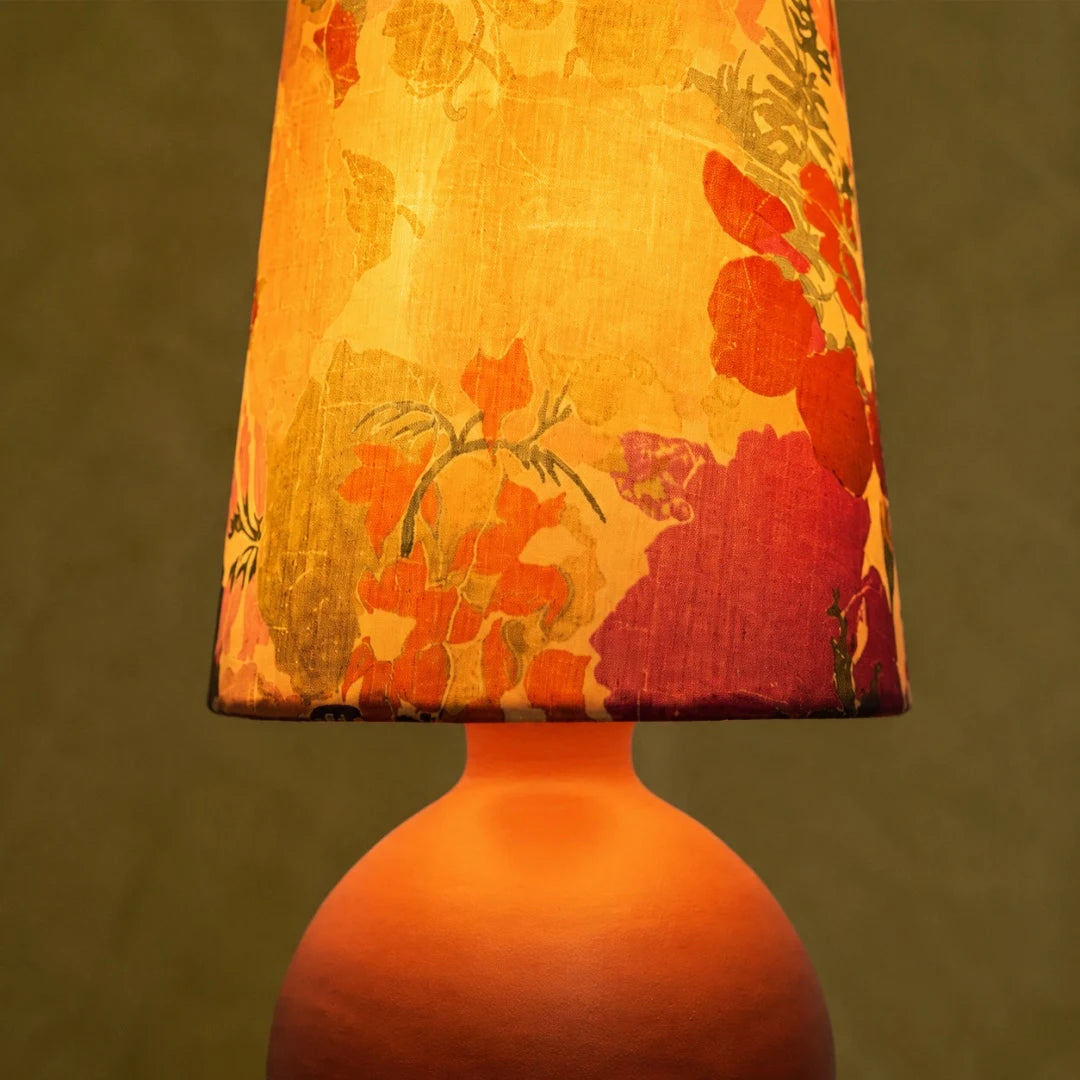 orange round base table lamp