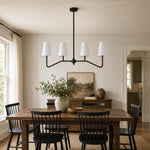 Bild in Gallery-Viewer laden, Strellux black linear chandelier in a dining room setting