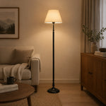 Charger l'image dans la visionneuse de galerie, Vintage floor lamp adding soft light beside a reading chair