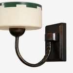 Load image into Gallery viewer, Glass shade, curved arm and hand-aged metal finish detail