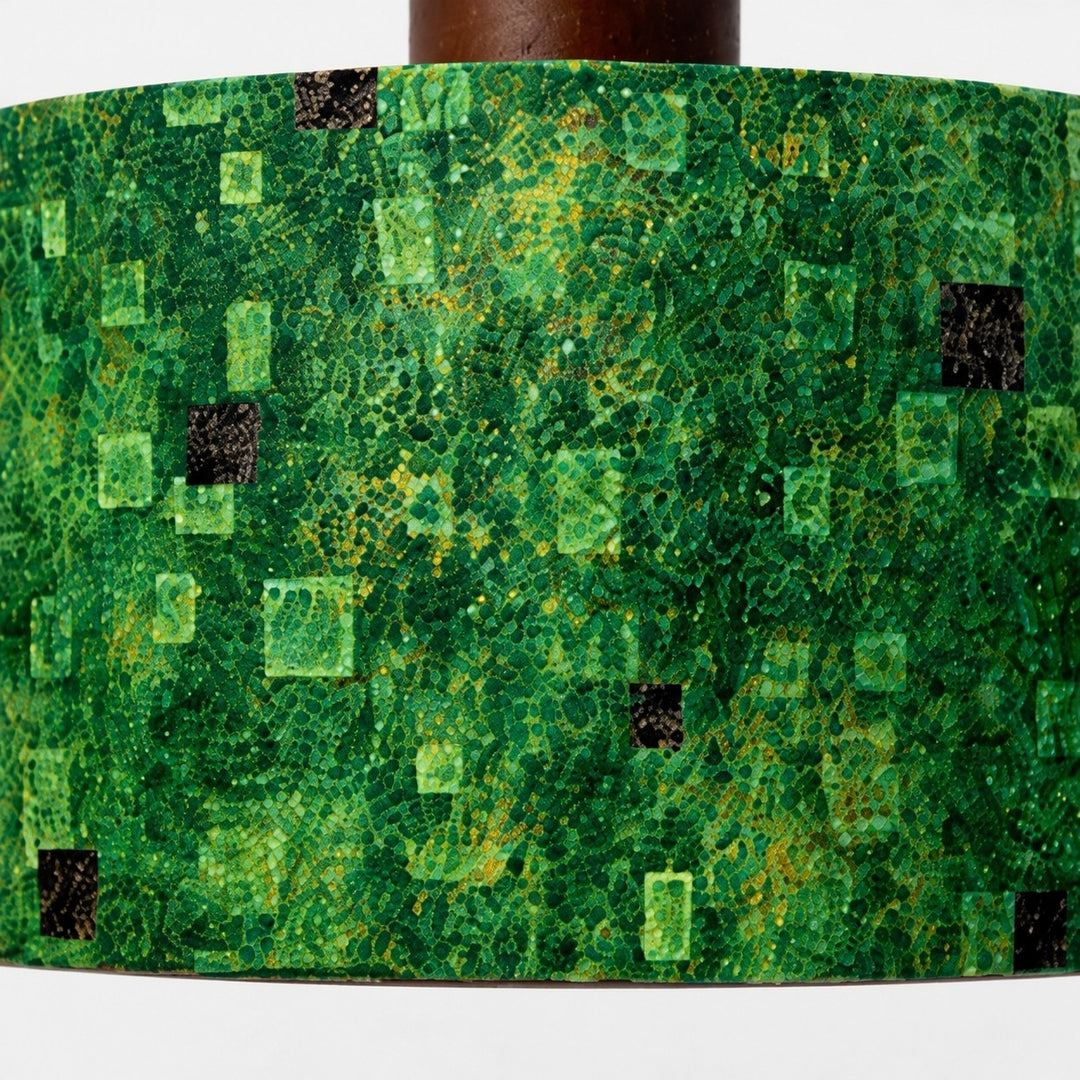 Close view of green gilded patterned fabric shade