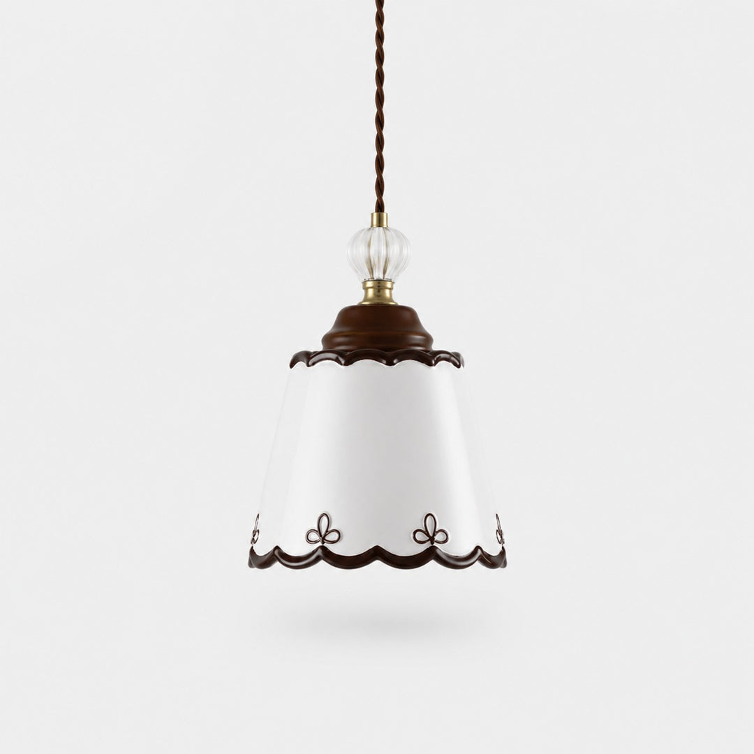 single hand-painted ceramic pendant light on a white background