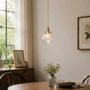 Bubble glass pendant above a small dining table