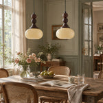 Charger l'image dans la visionneuse de galerie, Cream glass pendants over a dining table