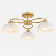 3-light brass ceiling fixture with white glass shades
