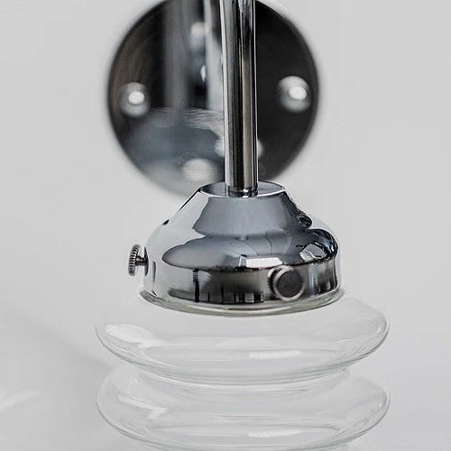 Chrome holder and clear ribbed glass shade detail