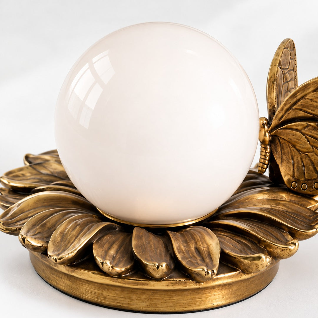 Round Globe Perched Motif Brass Resin Table Lamp