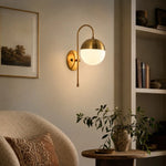 Bild in Gallery-Viewer laden, Gold milk glass wall lamp in a modern living room