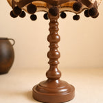 Bild in Gallery-Viewer laden, Close view of the turned brown table lamp base and pom pom trim