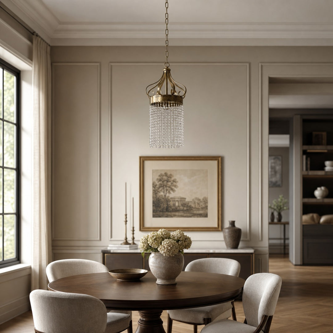 Clear crystal pendant light in a refined neutral dining room