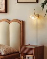 Load image into Gallery viewer, Looped Brass and Fluted Glass Plug-In Wall Lamp room scene 4