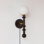 Load image into Gallery viewer, Walnut Stem and Glass Globe Plug-In Wall Lamp product view 12